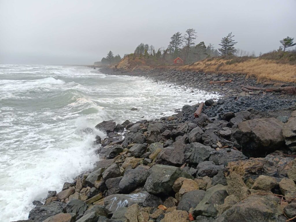 a rocky beach with waves crashing (MyCoast AI)