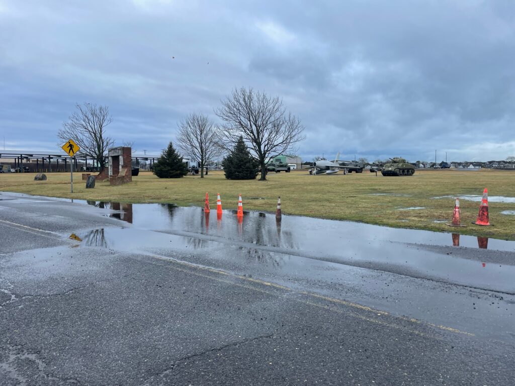 a road with cones and a puddle (MyCoast AI)