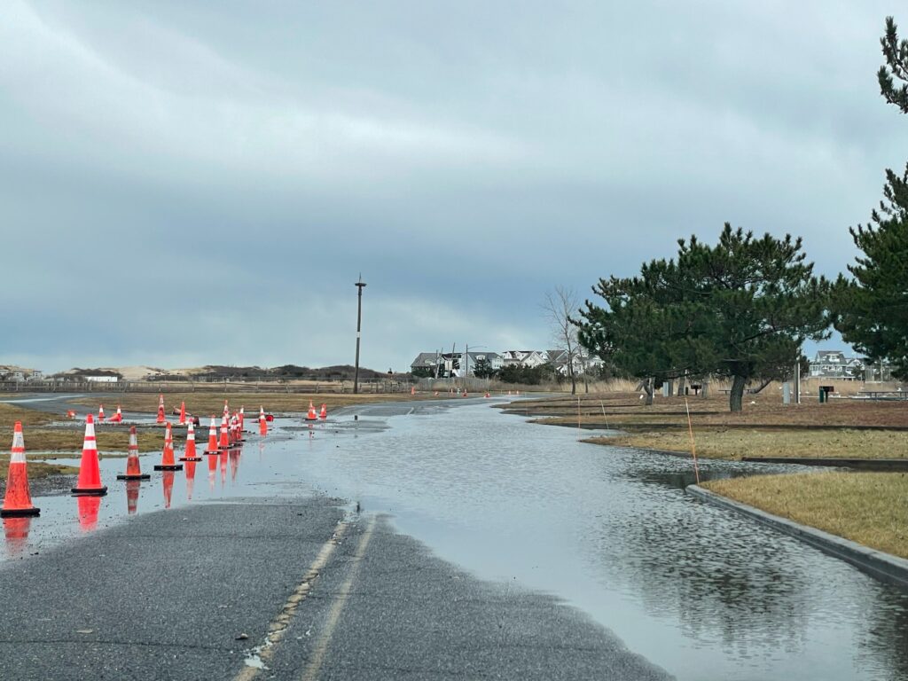 a road with orange cones on the side (MyCoast AI)