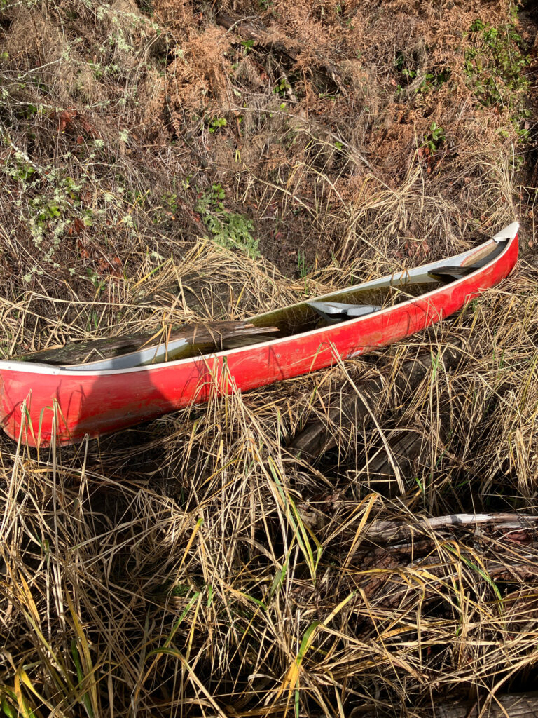 a red and white boat on the ground (MyCoast AI)