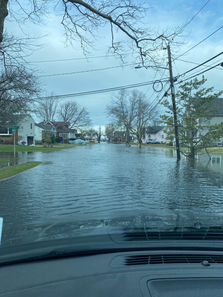 a flooded street with houses (MyCoast AI)