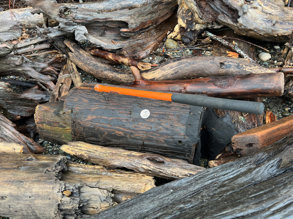 a knife on a pile of cut wood (MyCoast AI)
