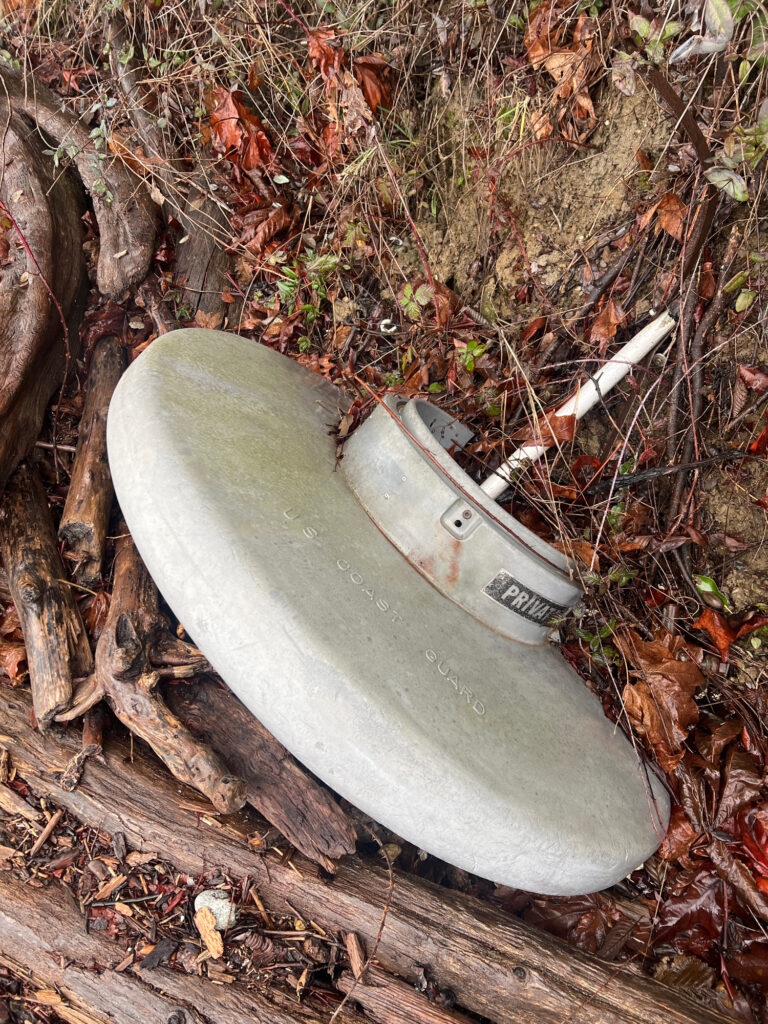 a broken toilet in the woods (MyCoast AI)