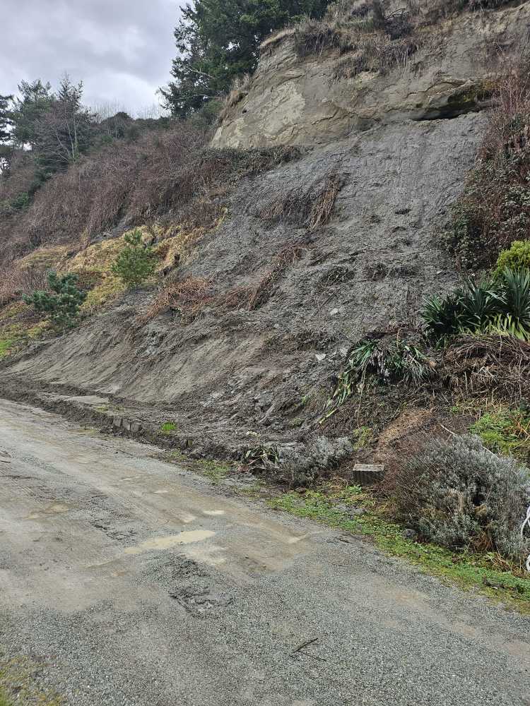 a dirt road next to a rocky cliff (MyCoast AI)
