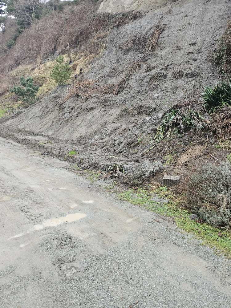 a dirt road with a sign on it (MyCoast AI)