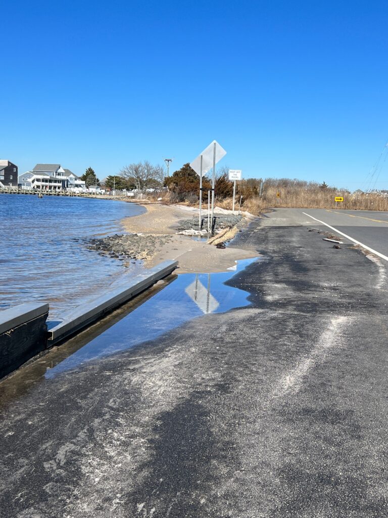 a road next to a body of water (MyCoast AI)