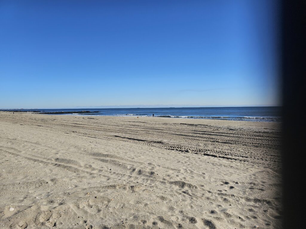 a sandy beach with blue sky (MyCoast AI)