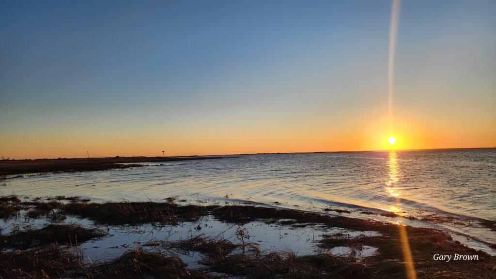 a sunset over a snowy field (MyCoast AI)