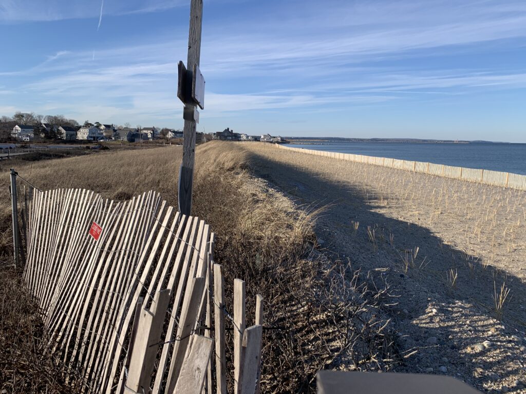 a wooden fence on a beach (MyCoast AI)