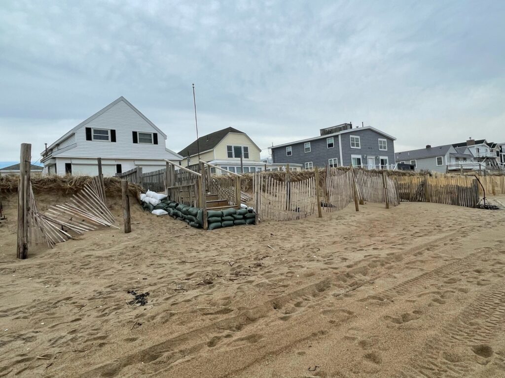 a fenced off area with a house in the background (MyCoast AI)