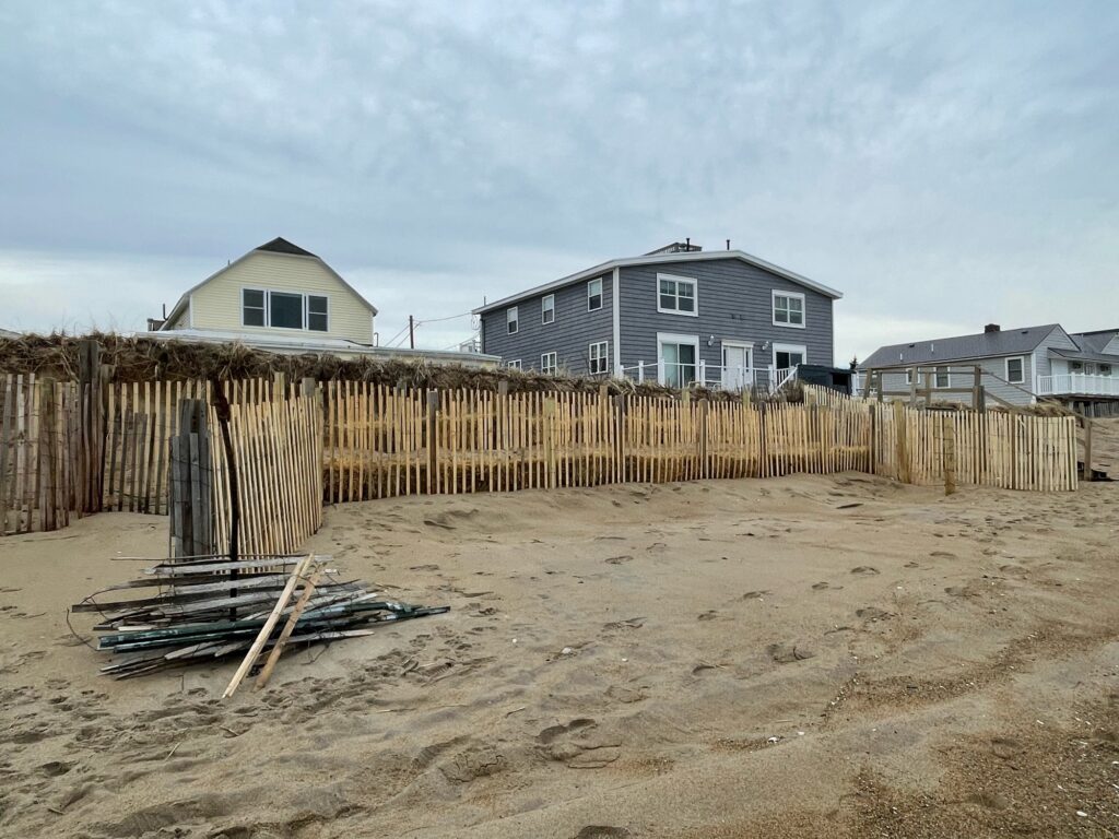 a fenced off area with a house in the background (MyCoast AI)