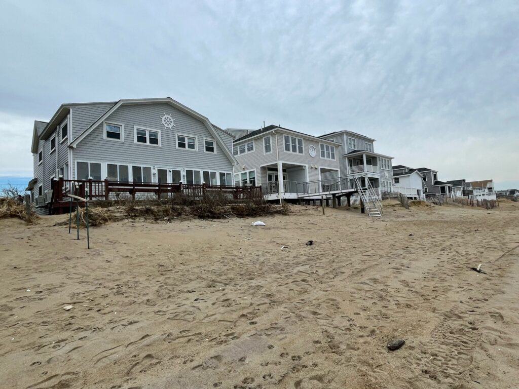 a row of houses on a beach (MyCoast AI)