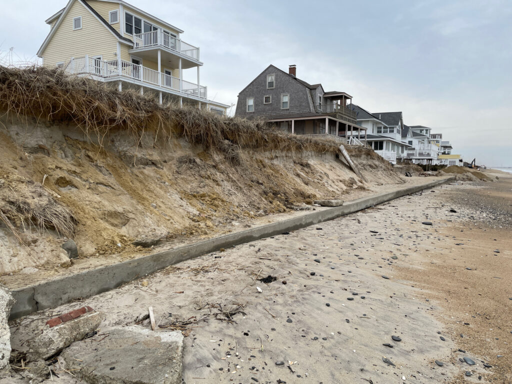 a beach with houses on the side (MyCoast AI)