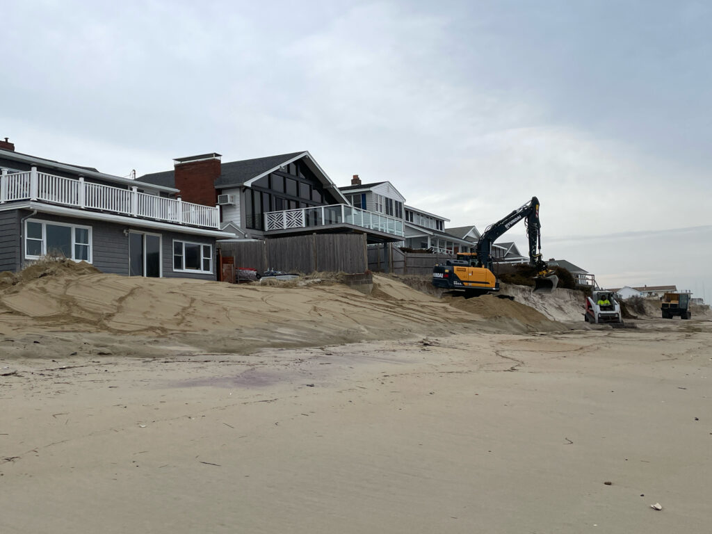 a construction vehicle in front of a house (MyCoast AI)