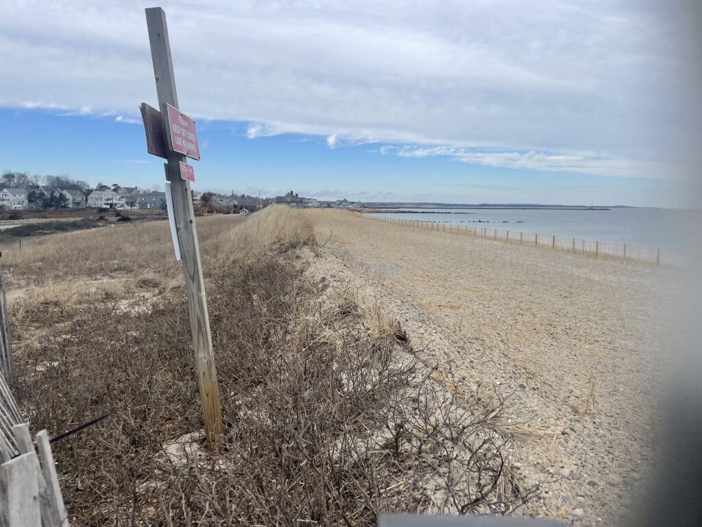 a beach with a sign (MyCoast AI)
