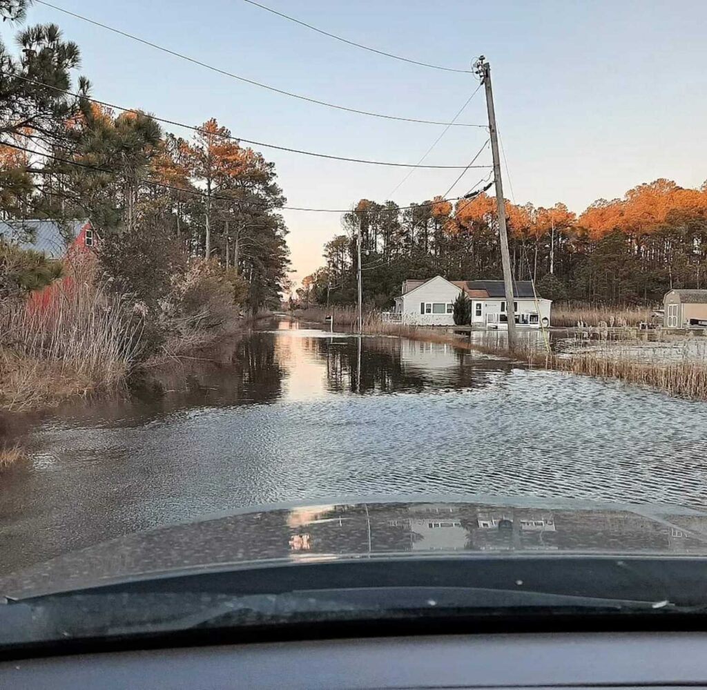 a flooded area with a house in the background (MyCoast AI)