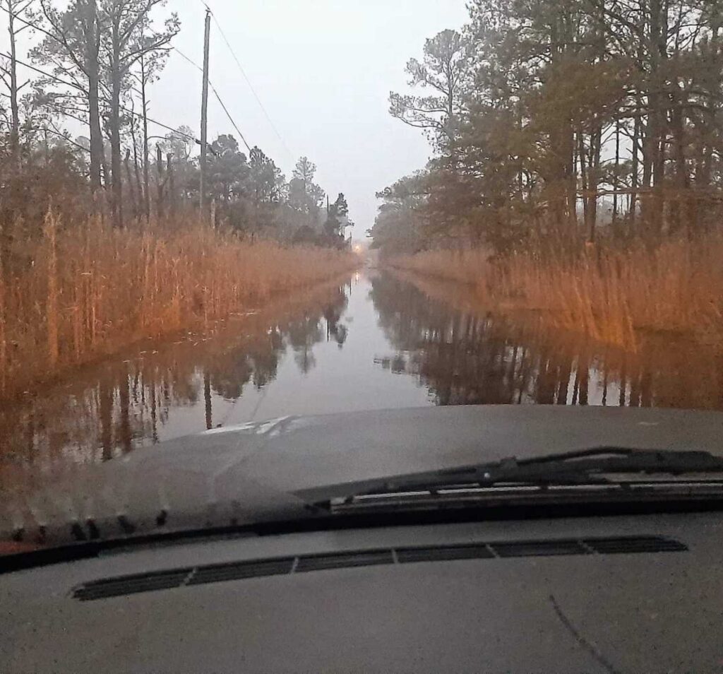 a car driving on a wet road (MyCoast AI)