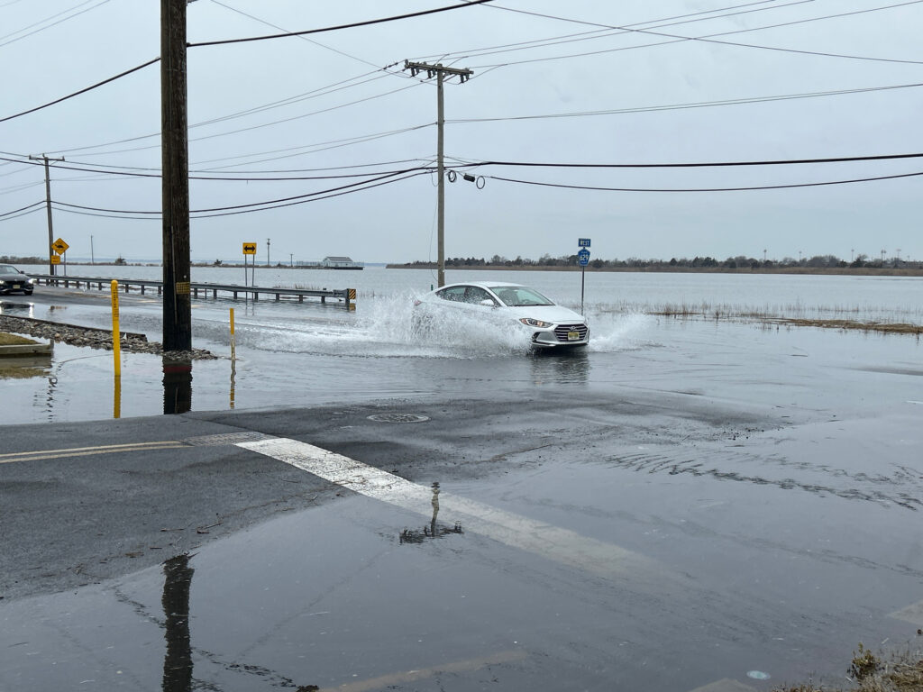 a car driving through a flooded road (MyCoast AI)