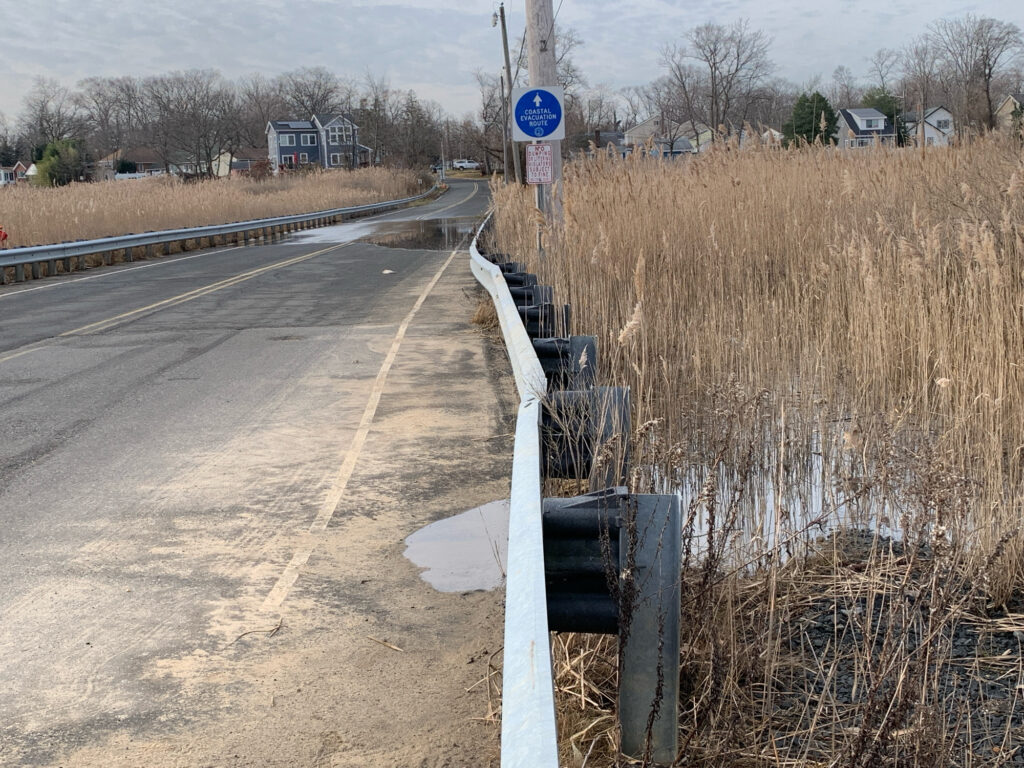a road with a sign on it (MyCoast AI)