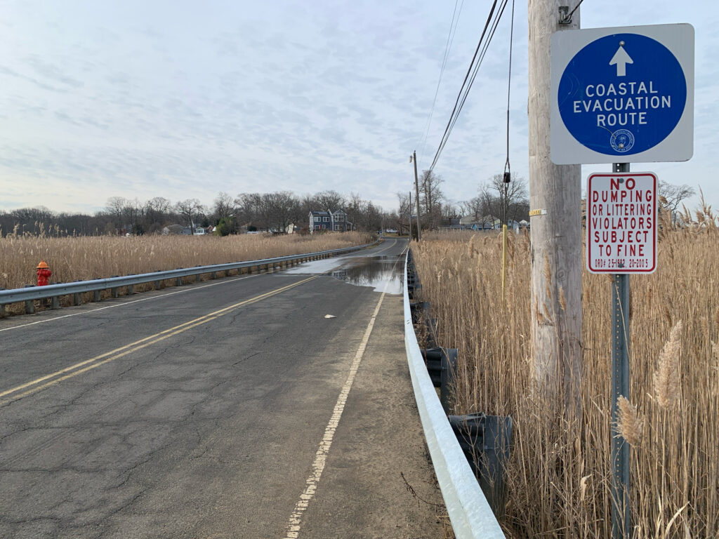a sign on the side of a road (MyCoast AI)