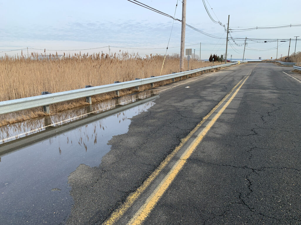 a road with water on the side (MyCoast AI)