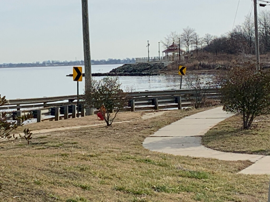 a bench sits by a body of water (MyCoast AI)