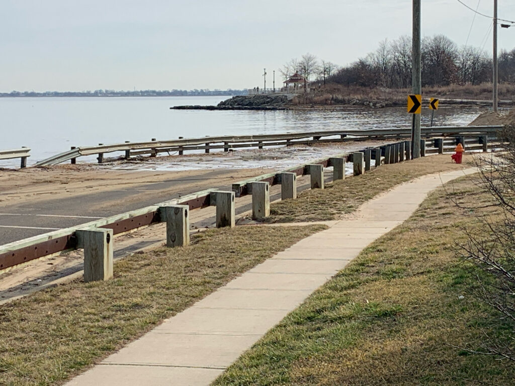 a sidewalk next to a body of water (MyCoast AI)