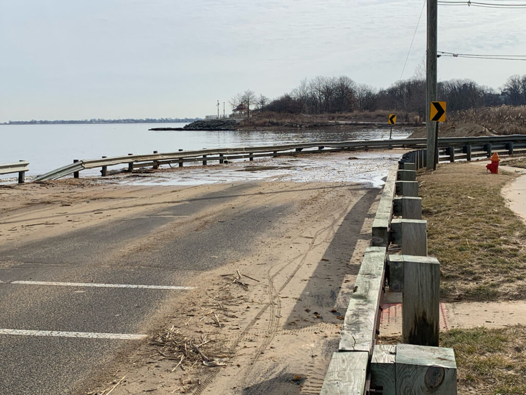 a road with a body of water in the background (MyCoast AI)