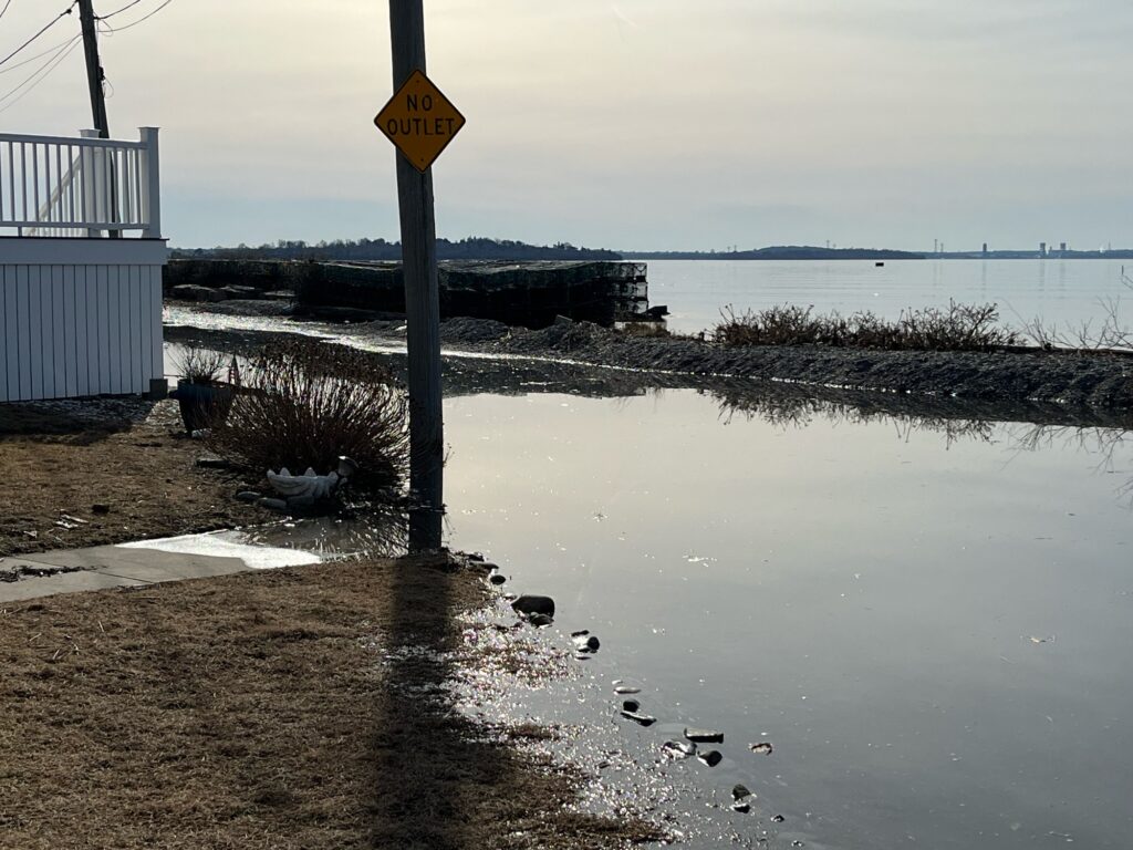a flooded area with a sign (MyCoast AI)
