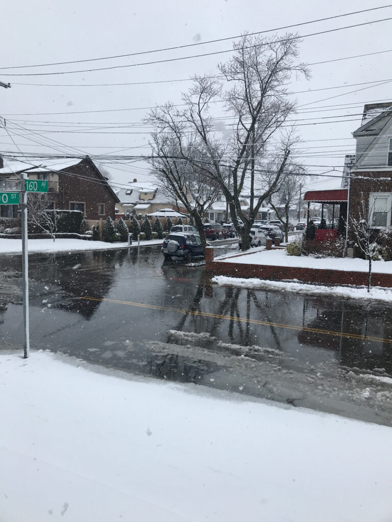 a street with snow on the ground and houses on the side (MyCoast AI)