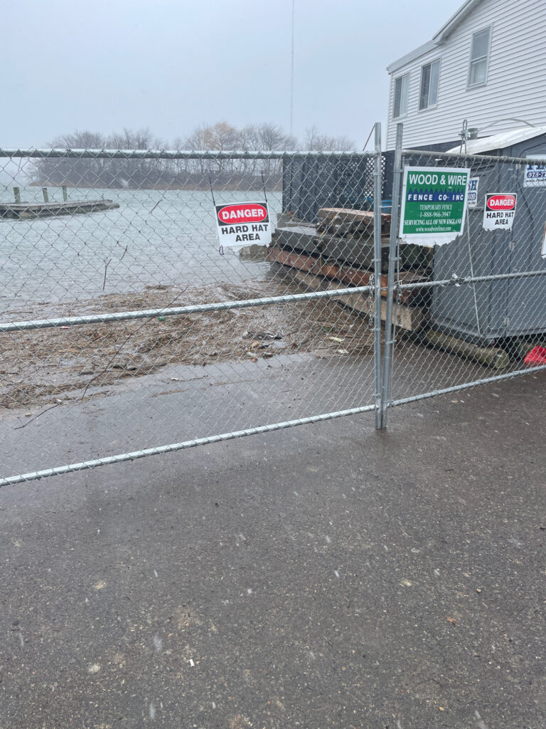 a fenced off area with a sign on it (MyCoast AI)