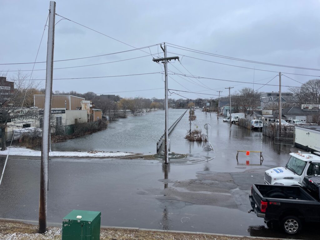 a flooded street with cars and power lines (MyCoast AI)