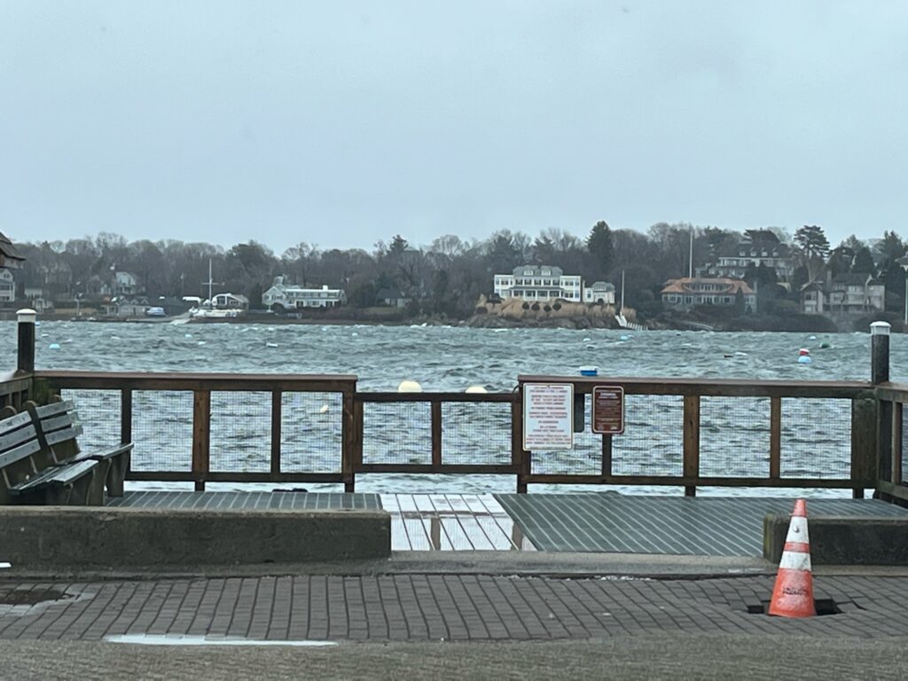 a body of water with benches and a boat in it (MyCoast AI)
