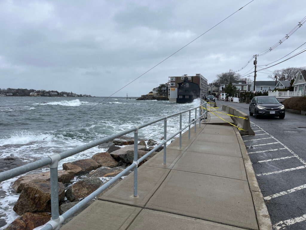 a car driving on a road next to a body of water (MyCoast AI)