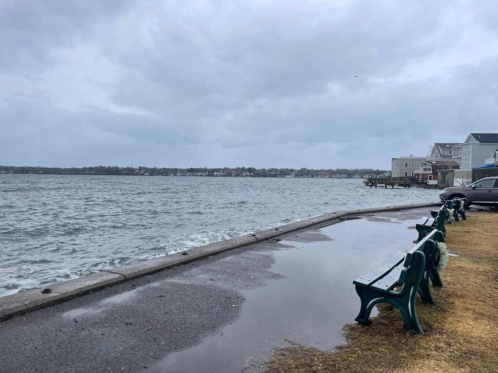 a bench sits by the water (MyCoast AI)