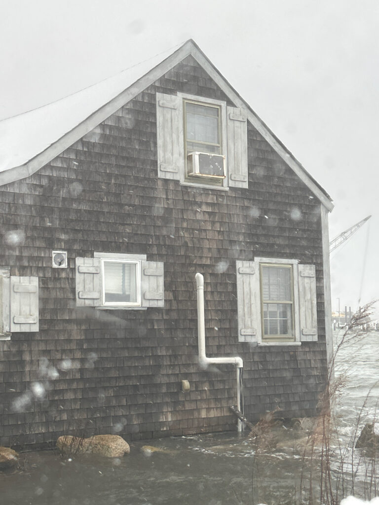 a brick building with snow on the ground (MyCoast AI)