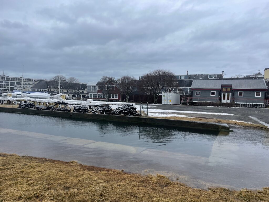 a body of water with buildings in the background (MyCoast AI)