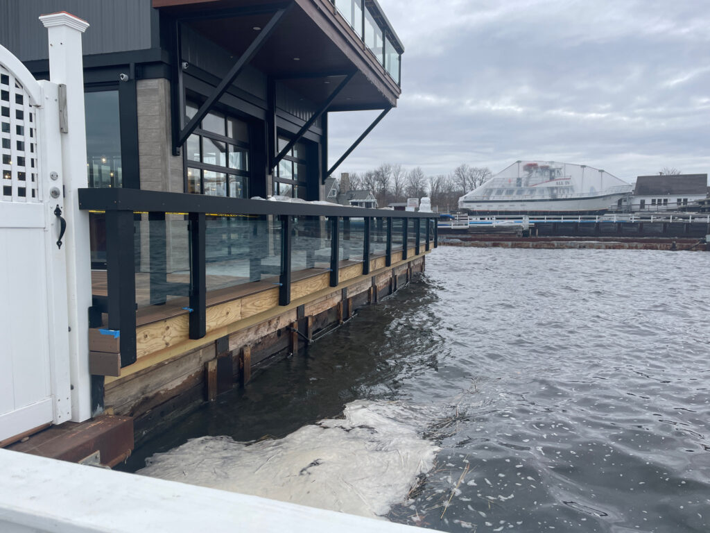 a building next to a body of water (MyCoast AI)