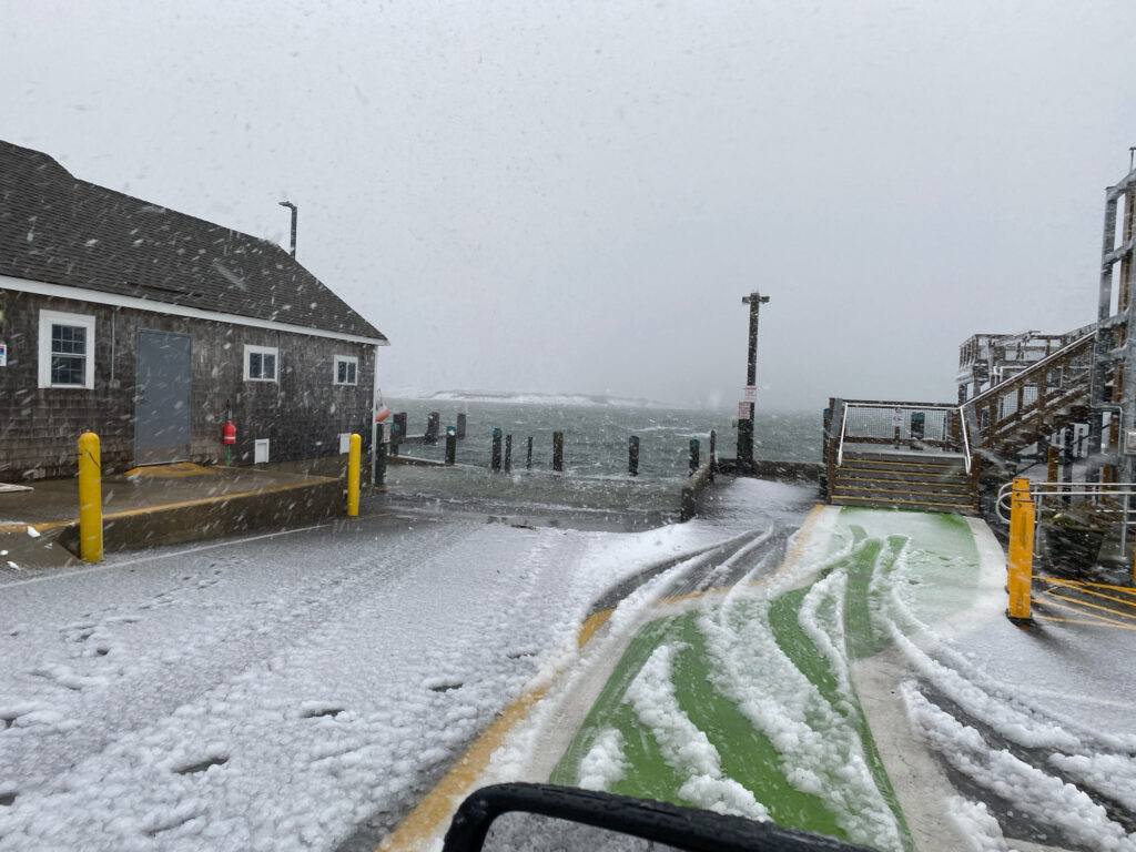 a snowy road with buildings on either side of it (MyCoast AI)