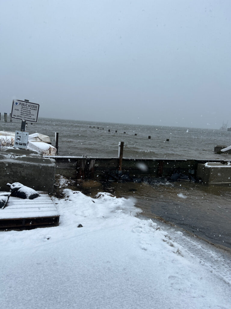 a snowy beach with a sign (MyCoast AI)