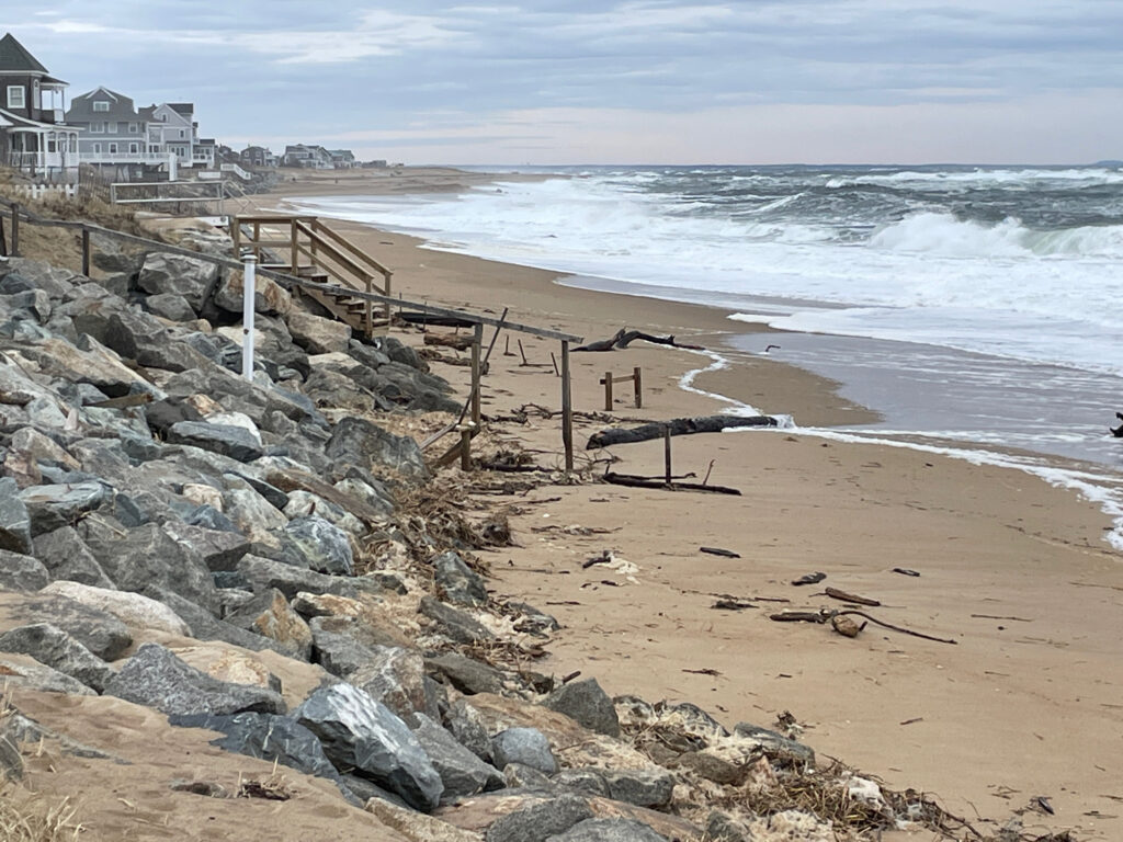 a rocky beach with a pier (MyCoast AI)