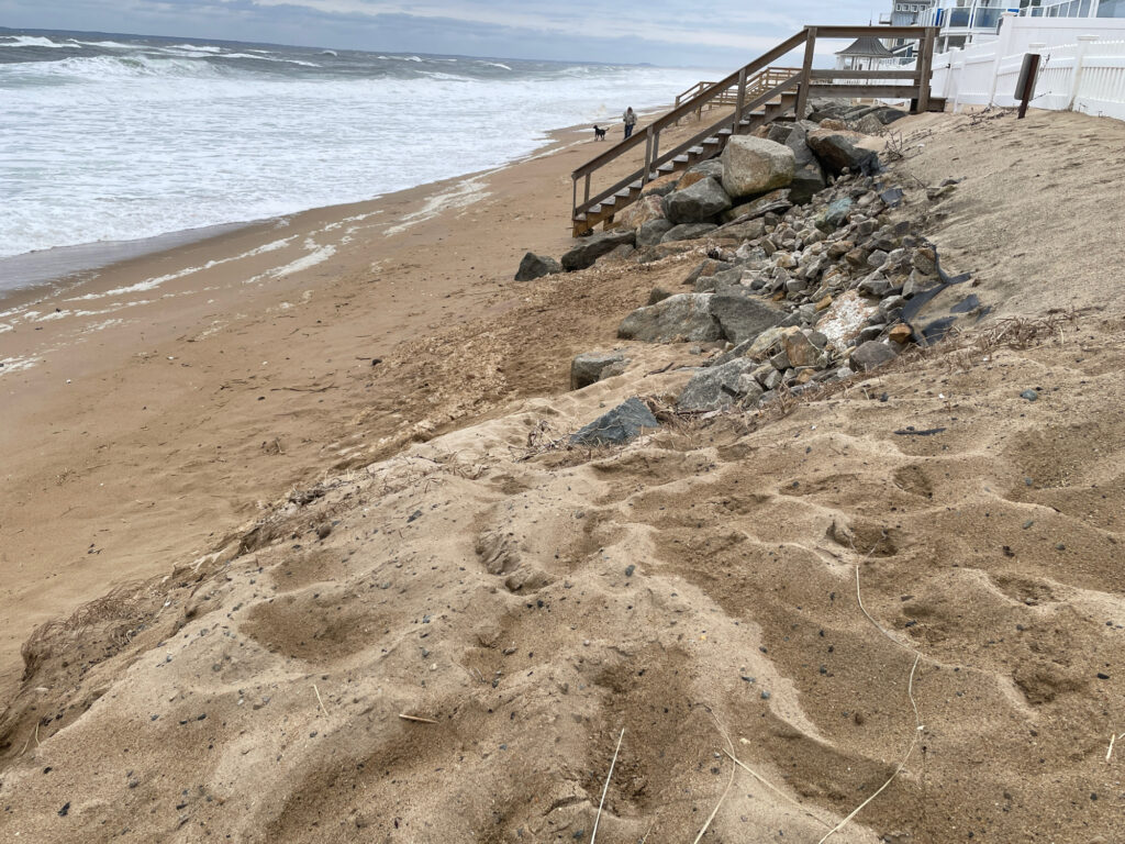 a beach with rocks and a pier (MyCoast AI)