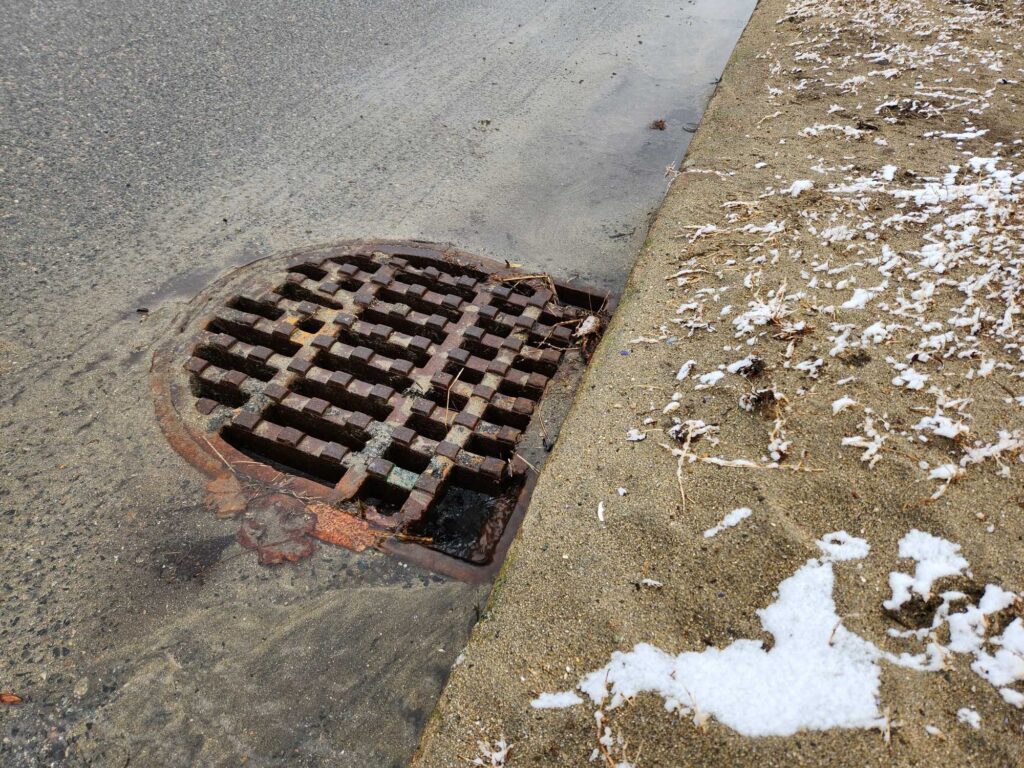 a drain in the street (MyCoast AI)