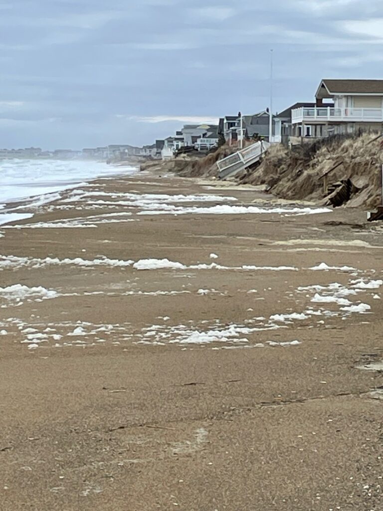 a beach with waves crashing on it (MyCoast AI)
