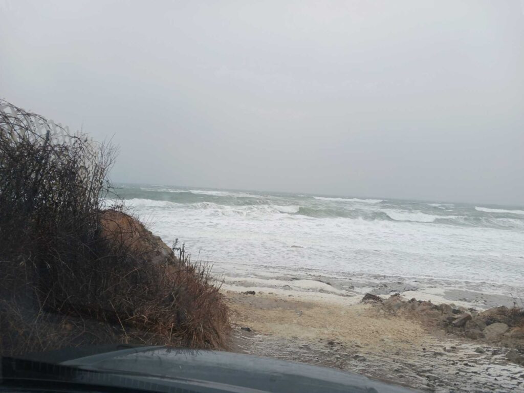 a beach with waves crashing (MyCoast AI)