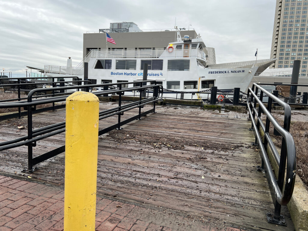 a boat docked at a pier (MyCoast AI)