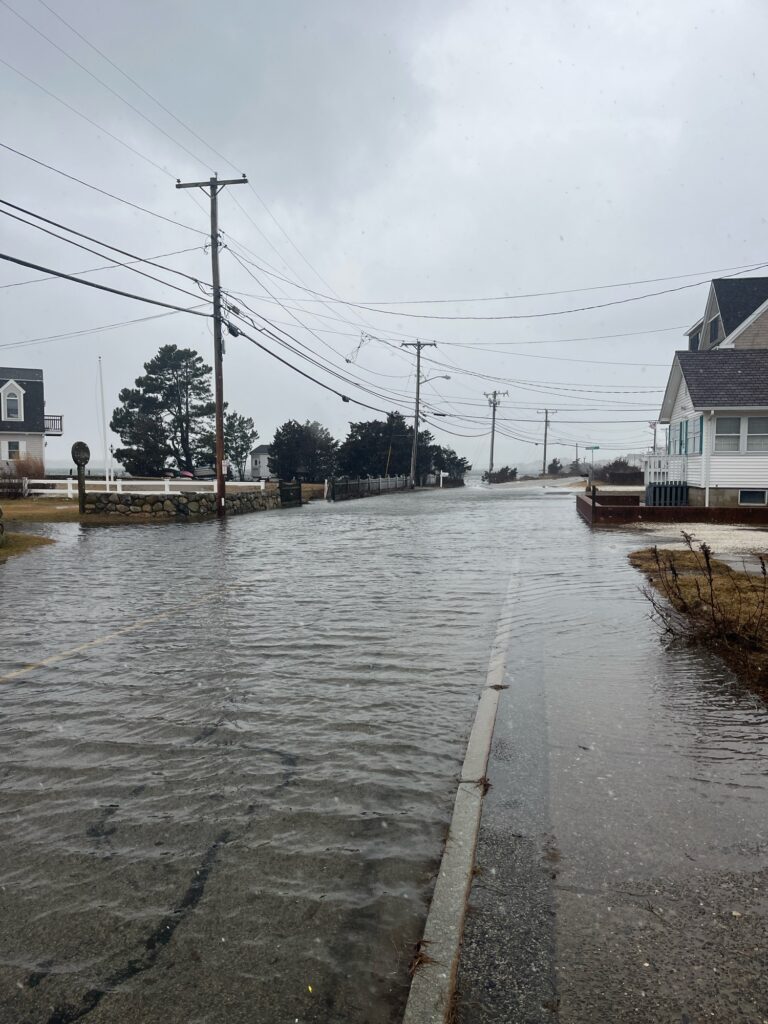 a flooded street with power lines (MyCoast AI)