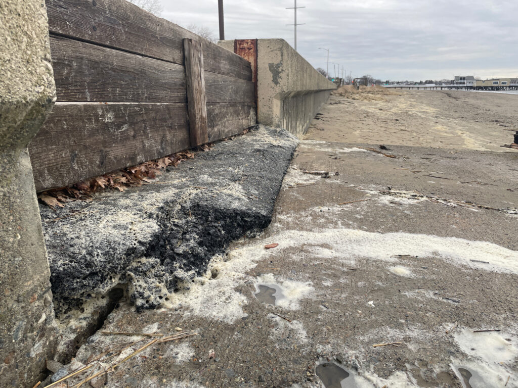 a concrete wall with a hole in it (MyCoast AI)