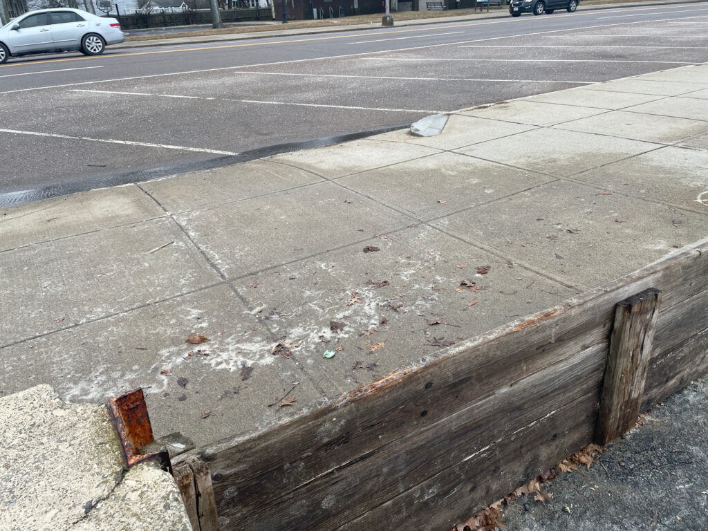 a bench on the side of a road (MyCoast AI)