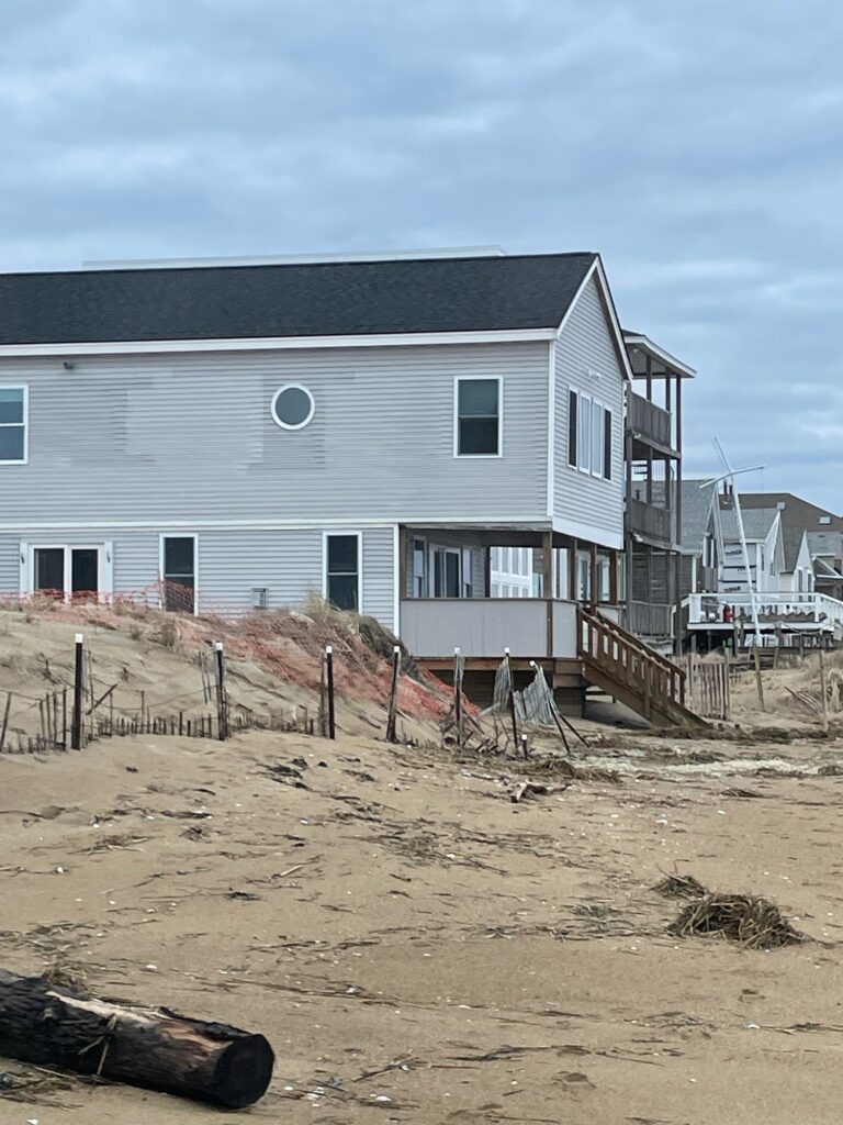 a house with a fence around it (MyCoast AI)